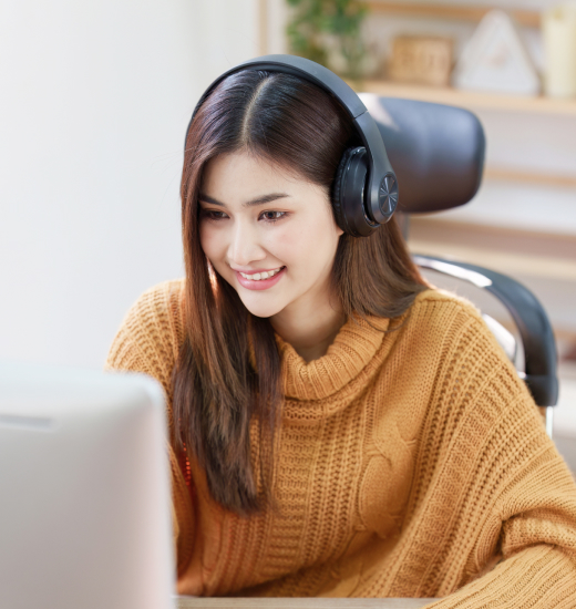 A woman studying and listening to online thai language course
