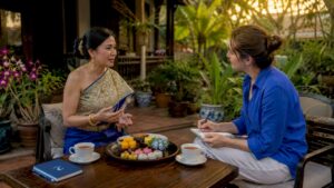 Thai woman and visitor in cultural communication exchange