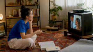 Woman watching Thai TV for language learning