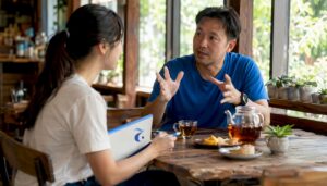 Learner practicing Thai conversation with instructor