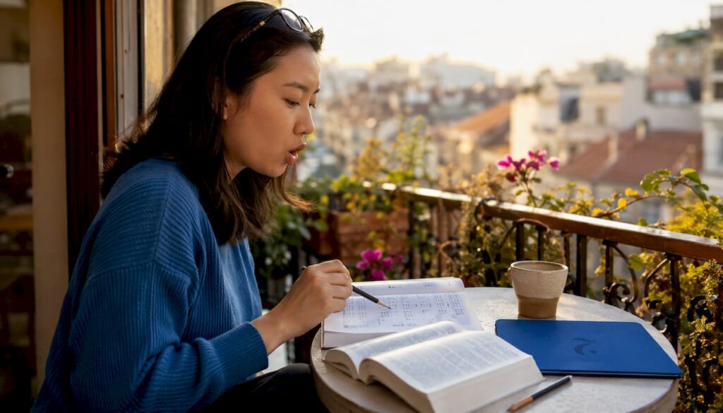 Woman studying tonal language at home table