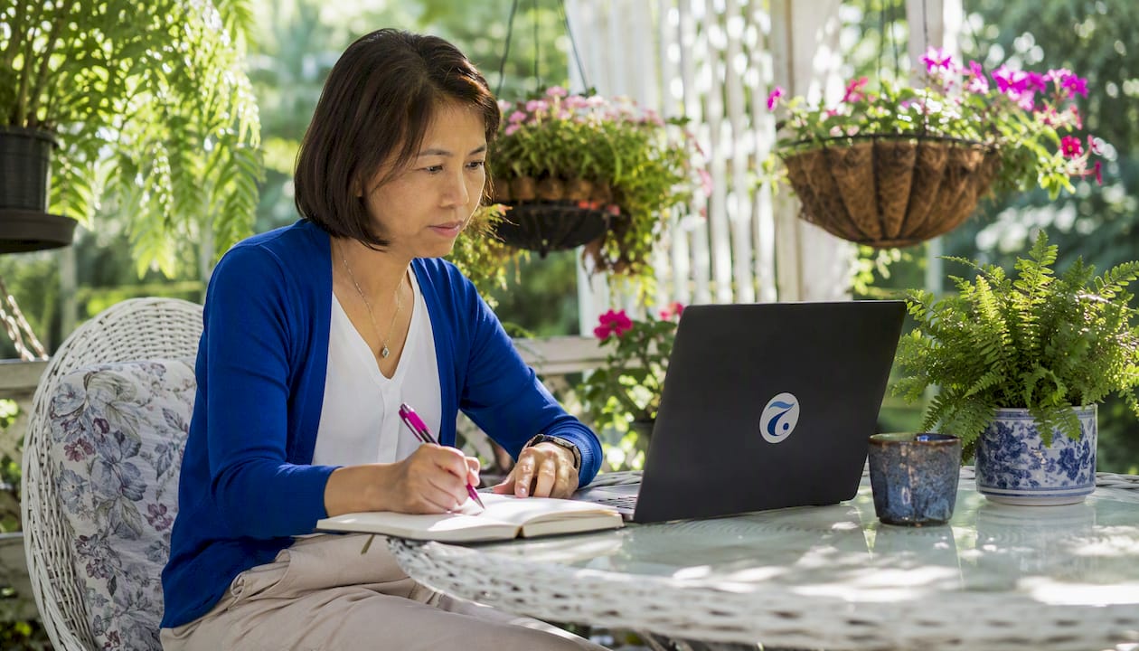 Woman attending live Thai language class at home