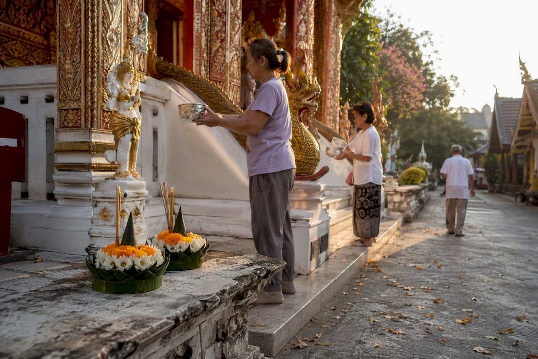 Early morning Buddhist temple ritual in Thailand