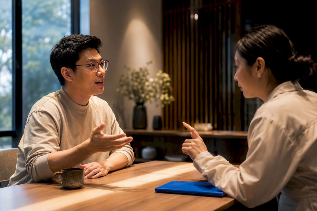 Adult learner practicing Thai with instructor